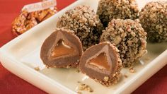 three pieces of chocolate covered dessert on a white plate