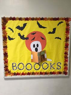 a bulletin board decorated with books and bats