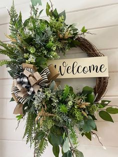 a wreath with the word welcome hanging on it