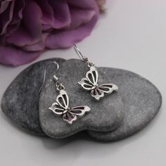 Handmade Antique silver cut out butterfly earrings with 925 Sterling silver hooks. These earrings would be a fabulous addition to anyone's earring collection. They are very understated elegant and truly stunning, a perfect gift for anyone who loves butterflies.  Matching butterfly pendant necklace available from our shop.  Made with   ⭐Antique silver butterfly charm (measures 25x13mm) ⭐925 Sterling silver ear hooks Finished with rubber bell shaped stoppers presented on a beautiful floral and bir Silver Butterfly Earrings, Earring Collection, Butterfly Pendant Necklace, Bird Cards, Silver Butterfly, Butterfly Charm, Butterfly Earrings, Butterfly Pendant, Earrings Collection