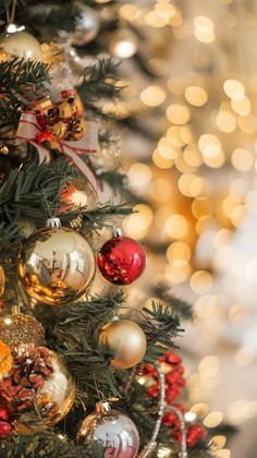 a decorated christmas tree with red and gold ornaments