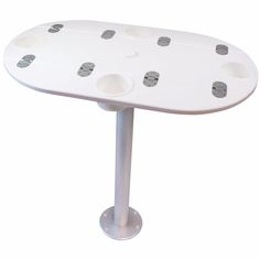 a white table with six holes on it