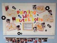 a bulletin board with pictures and magnets on it that says painting with nuts & bolts