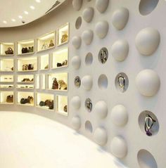 there are many pairs of shoes on the wall