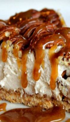 a piece of cheesecake covered in caramel drizzle