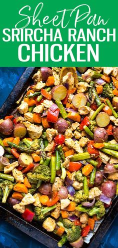 a sheet pan filled with chicken and veggies on top of a blue cloth