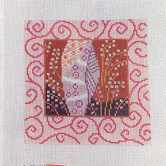 a cross stitch picture with an image of the virgin mary