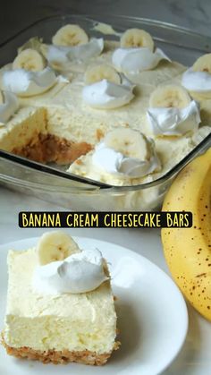 banana cream cheesecake bars with whipped cream on top and bananas in the back ground