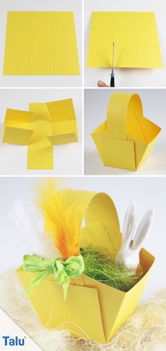 an origami box that is made out of yellow paper with white rabbits in it