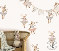 a stuffed animal sitting on top of a chair in front of a wall with ballet decorations