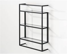 a metal shelf with glass shelves on the side and one shelf below it, against a white wall