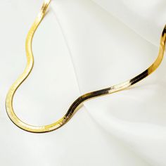 Invented by the Egyptians and perfected over centuries, this classic herringbone necklace will elevate your look with its liquid gold sheen. The thoughtfully designed sleek clasp lies flat so that you can wear it comfortably layered with your favorite chains. Crafted from hand-assembled links and thickly layered with 1 Outer Core, Brazilian Gold, Herringbone Chain, Herringbone Necklace, Layered Chains, Liquid Gold, Broken Chain, Donate To Charity, Elevate Your Look