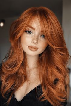 The rich auburn color adds warmth, while the side bangs frame the face beautifully, giving the layered cut added style and movement. Auburn Hair For Brown Eyes, Aurburn Hair Color, Natural Red Hair Brown Eyes, Vibrant Auburn Hair Color, Pale Skin Freckles Hair Color, Copper Hair With Tan Skin, Auburn Curtain Bangs, Ginger Hair Shadow Root, Pretty Ginger Hair