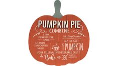 a wooden sign with the words pumpkin pie written in white writing on it and an orange pumpkin