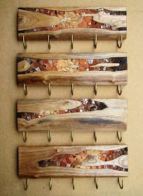 four wooden skis mounted to hooks on a wall