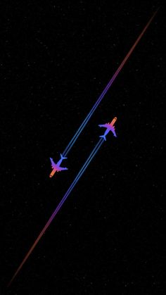 two airplanes flying in the sky at night