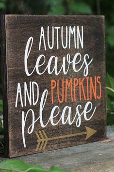 a wooden sign that says autumn leaves and pumpkins please