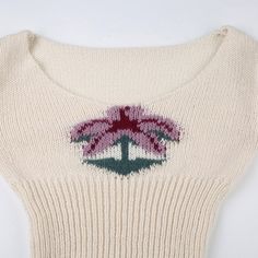 Introducing the Maiya Palm Knit Sweater, a perfect blend of cozy comfort and playful style. Crafted from soft, high-quality knit fabric, this sweater offers a snug fit that flatters your figure while keeping you warm. The standout feature is the charming palm tree design embroidered on the front, adding a touch of whimsy to your everyday look. The off-white color makes it versatile, easy to pair with your favorite jeans or skirts for a chic, laid-back ensemble. With its long sleeves and subtle s Bodysuits And Jeans, Palm Tree Design, Long Halter Dress, White Long Sleeves, Knitted Long Sleeve, Slim Sweater, Stunning Tops, Playful Style, Floral Sweater