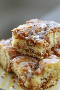 several pieces of cake sitting on top of a yellow and white plate