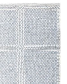 a blue and white rug with three squares on the bottom, one square in the middle