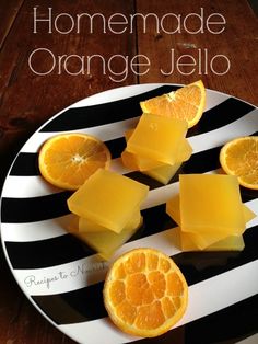 orange jello on a black and white striped plate