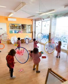 several children are playing with their toys in the room at school or playrooms