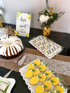 a table topped with cakes and desserts on top of plates