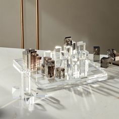 a group of glass blocks sitting on top of a white table next to each other