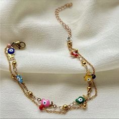 2 Bracelets In 1 For A Layered Look One Gold Plated Chain Link Bracelet & 1 Multi Candy Colored Camel Charm Bracelet Green, Red, Yellow, Purple, Blue, Green And Pink Colored Evil Eye With Gold Camel Charm Detailing Clasp Closure So Gorgeous & Chic Most Beautiful Gift Around 8.66 Inch & 2.36 Inch Extended Chain New. Perfect Condition Valentine’s Day Love Gift Colorful Rainbow Multicolor Copper Trendy Gorjana White Gold Silver Metallic 14k Adinas Jewels Swarovski Yellow Gold Black Pupil Diamond Ac Trendy Adjustable Charm Bracelet With Delicate Chain, Trendy Charm Bracelet With Delicate Chain, Adjustable Chain Bracelet Summer Gift, Adjustable Chain Bracelet As Summer Gift, Adjustable Chain Bracelet For Summer Gift, Adjustable Multicolor Chain Bracelet For Party, Gold Chain Bracelet As Summer Gift, Adjustable Chain Bracelets For Summer, Trendy Multicolor Charm Bracelet