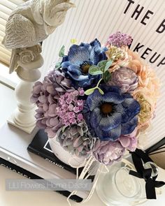 a bouquet of flowers sitting on top of a table