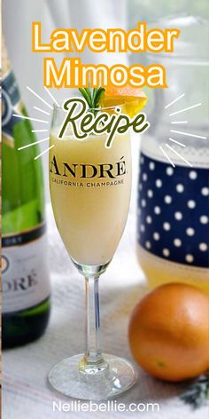 the recipe for lavender mimosa is in a wine glass with an orange on top