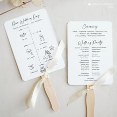 two wedding programs with ribbons tied to them