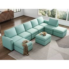 a living room with a sectional couch and ottoman