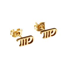 two pairs of gold earrings with the word pi on them, set against a white background