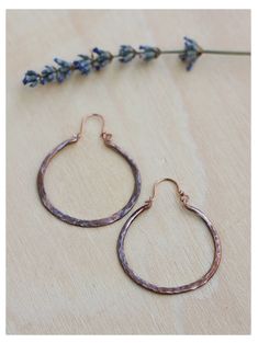 Lovable thick hoops handmade to last in solid copper, sterling silver, brass or titanium wire. Hand forged, and oxidized to highlight textures, and comfy for everyday wear! Great look as is or add some dangles to an extra spark! This textured copper hoops are crafted from 12 gauge wire. Shaped, drilled, hammered, textured and oxidized by hand. ♥ You will receive a set of 2 hammered hoops of 1 inch (25 mm) or 1 1/2 inches (30 mm) inside diameter. Please select from menu. ♥ The texture on these ar Handmade Small Hoop Copper Earrings, Handmade Small Copper Hoop Earrings, Adjustable Small Hoop Copper Earrings, Nickel-free Copper Hoop Earrings, Hammered Copper Hoop Earrings As Gift, Copper Hammered Hoop Earrings As Gift, Small Hoop Hammered Copper Earrings, Small Copper Hoop Jewelry, Hammered, Electroformed Metal Hoop Earrings