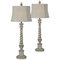 two lamps with white linen shades on each lamp, one is turned off and the other has