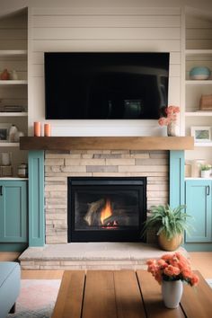 a living room with a fire place and television above the fireplace in front of it