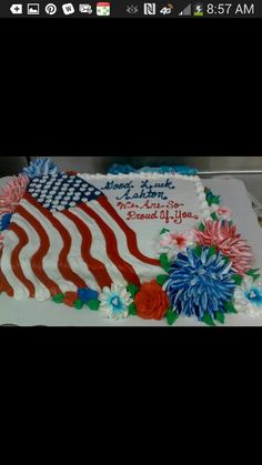 a cake decorated with an american flag and flowers