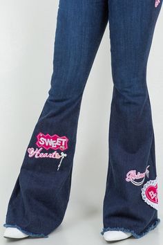 Upgrade your denim wardrobe with our Sweetheart Bell Bottom Jean in Dark Denim! These trendy jeans feature a flattering design with a front button and zipper closure, convenient front and back pockets, and adorable patch and charm accents. Made with premium fabrics in the USA, you can rely on their high-quality.DRY CLEAN ONLY. Silhouette: Bell bottom Fit: High Rise Embellishment: Patches, charms Length: Full Length Closure: button, zipper Made In: USA Fabric Contents: 98% Cotton, 2% Spandex Stre Corset Leggings, Patchwork Denim Jeans, Womens Fashion Jeans, Elegant Moments, Trendy Jeans, Country Fashion, Stylish Jeans, Bottom Jeans, Leather Denim