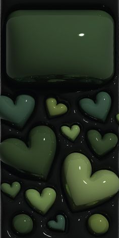 some green hearts are floating in the water