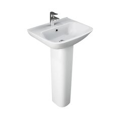 a white pedestal sink sitting next to a faucet