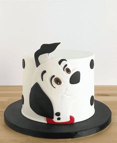 a decorated cake with a dog face on it