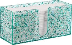 a tissue dispenser that is filled with lots of green and white glitter