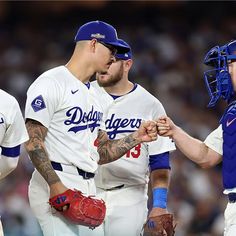 three baseball players standing next to each other