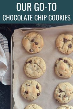 chocolate chip cookies sitting on top of a baking sheet with the words, our go - to chocolate chip cookies