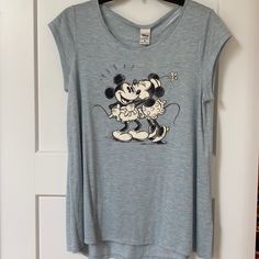 Lauren Conrad X Disney Short Sleeve Shirt. Light Blue With Spackled Pink And Orange Design. Mickey And Minnie Logo On Front. Size Medium And Never Worn Cute Tops With Character Print For Loungewear, Cute Character Print Tops For Loungewear, Spring Cotton Mickey Mouse Top, Spring Mickey Mouse Cotton Top, Relaxed Fit Tops With Character Print For Loungewear, Mickey Mouse Short Sleeve Summer Top, Minnie Mouse Crew Neck Top For Disney Trips, Cute Tops For Disney Fan Events In Summer, Disney Style Tops For Summer Fan Events