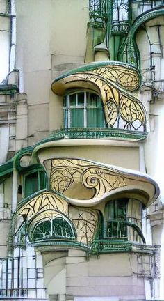 an ornate building with balconies and windows