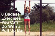 a woman is doing pull up bars outside