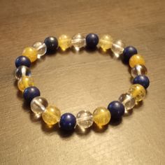 Zeus Beaded Bracelet Made with rutilated quartz, clear quartz & lapis lazuli to represent the God of the Sky. Rutilated Quartz, Clear Quartz, Lapis Lazuli, Bracelet Making, Arm Band, Beaded Bracelet, The Sky, Etsy Accessories, Jewelry Bracelets