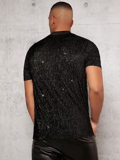 This Men's Black Mesh Crewneck Sequin Short Sleeve Shirt features lightweight mesh fabric and a shimmery sequin pattern for a unique and stylish look. The construction is breathable and comfortable, making it a great choice for warm-weather days. 100% Poly Imported Pull On closure Hand Wash Brand Size Chest Waist S 43.7 40.6 M 45.7 42.5 L 48.7 45.5 XL 51.7 48.5 XXL 54.6 51.5 Stretch Contrast Sequin Tops For Party Season, Stretch Tops With Contrast Sequin For Night Out, Black Stretch T-shirt For Party, Fitted Black T-shirt For Party, Party Crew Neck Top With Contrast Sequin, Contrast Sequin Crew Neck Top For Party, Glitter Tops For Party Season With Short Sleeves, Glitter Crew Neck Tops For Night Out, Fitted Sequined T-shirt For Party Season